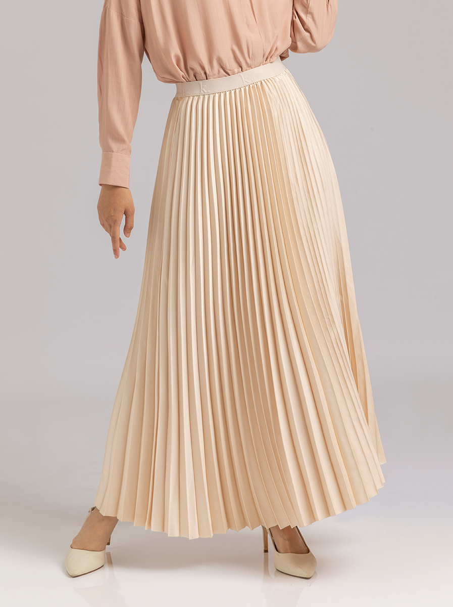 SATIN PLEATED SKIRT IN PLAIN IVORY –